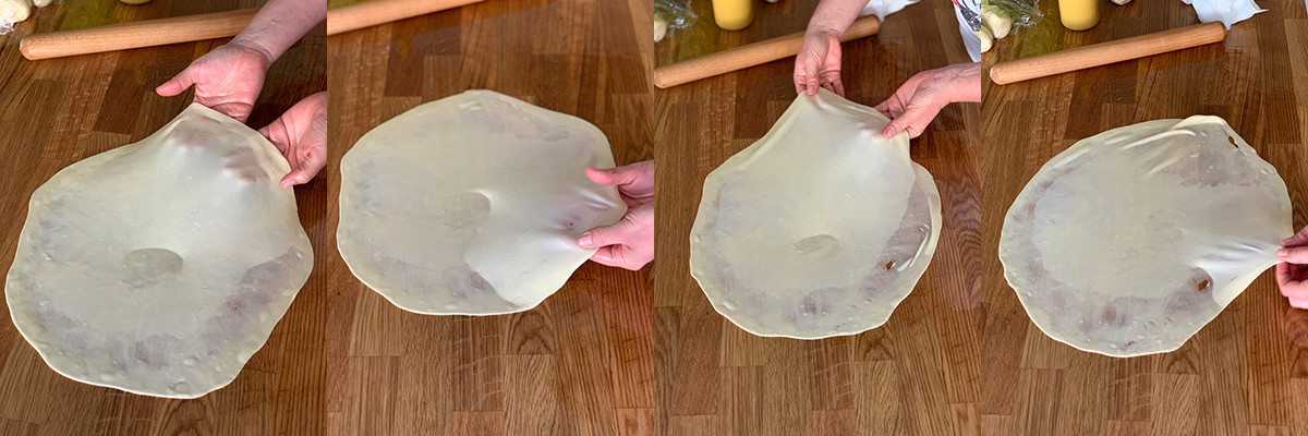 Stretching the dough for vertuta pastry. Best cooking recipes with step-by-step photos.